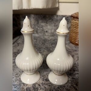 Lenox Salt and Pepper shakers. 5 1/2 inches tall. 6 holes